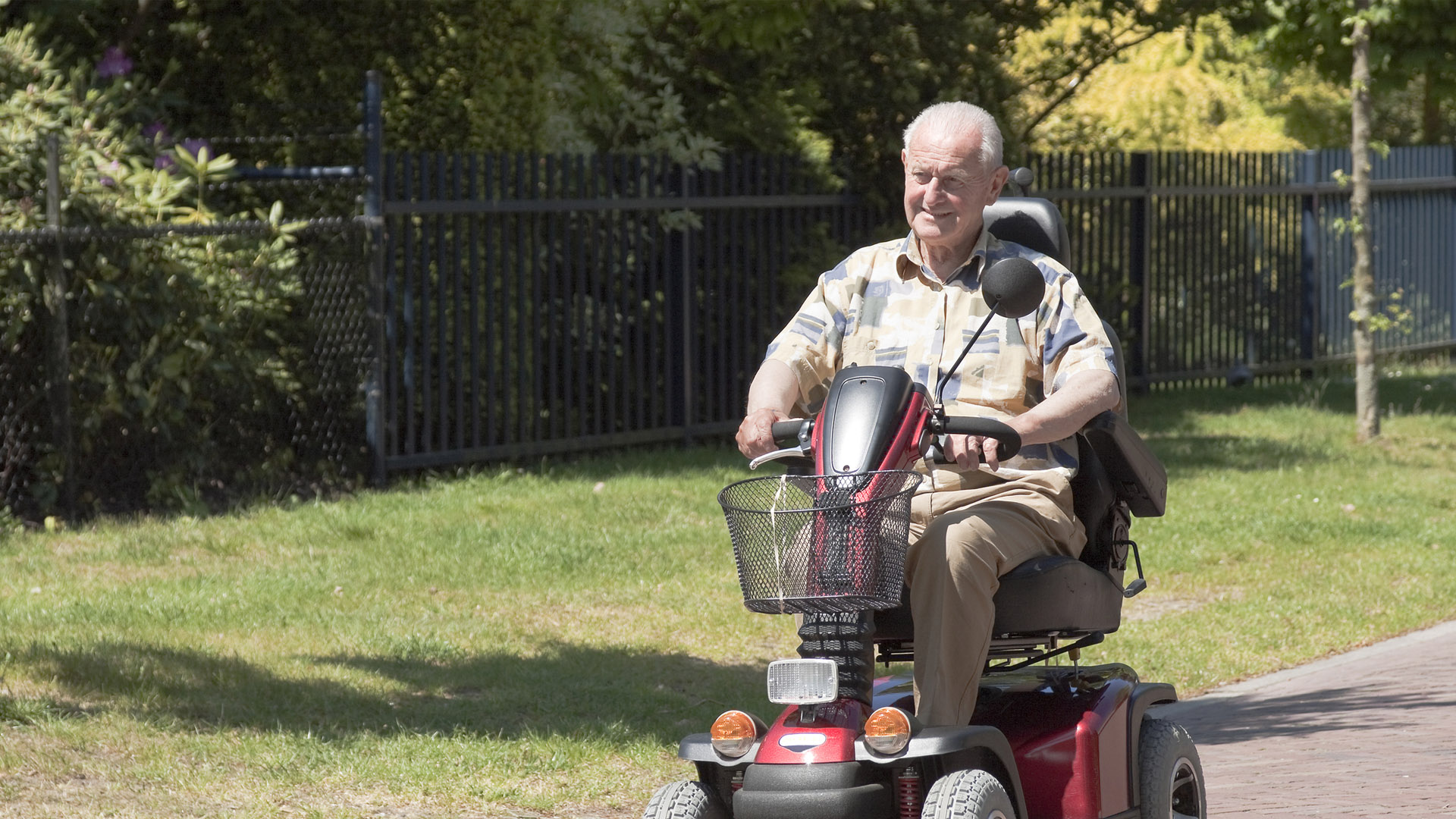 elderly man on mobility device