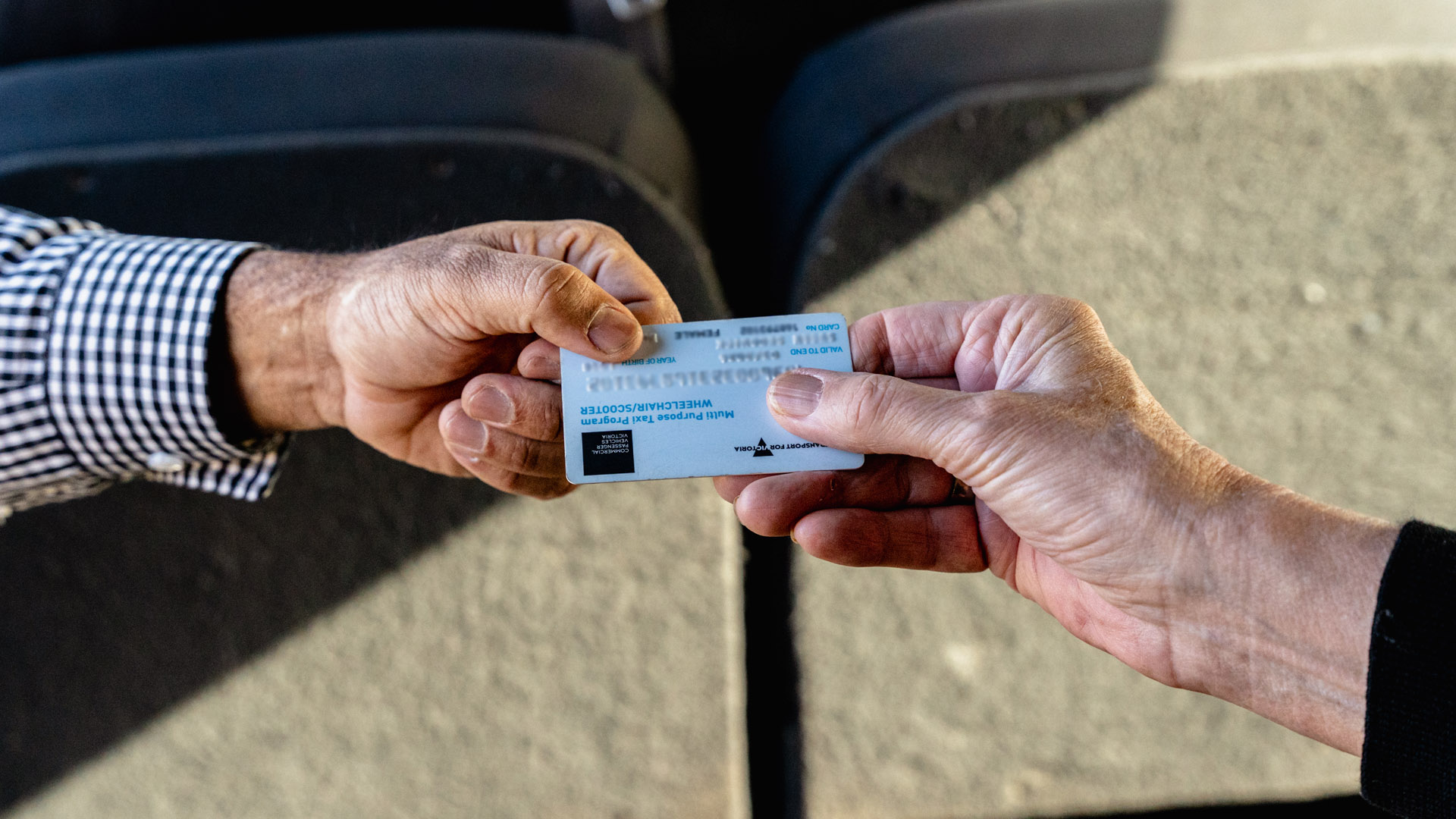an MPTP card is exchanged between a driver and a passenger